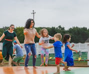 Kids and parents on the jumping pillows at the Fun Farm